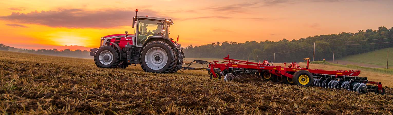 Massy Tractor with Sunflower tiller in field